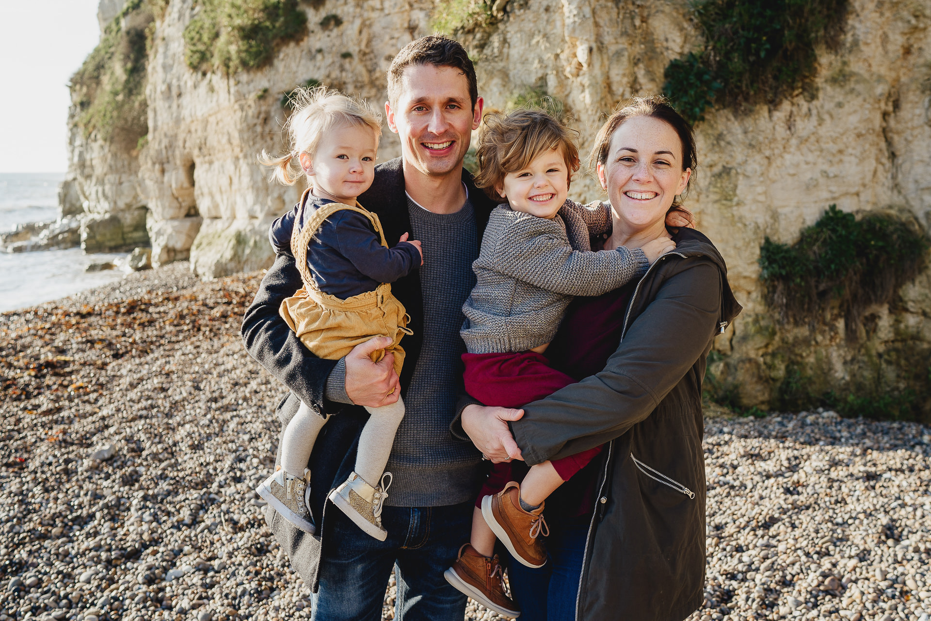 A family group photo on a beach