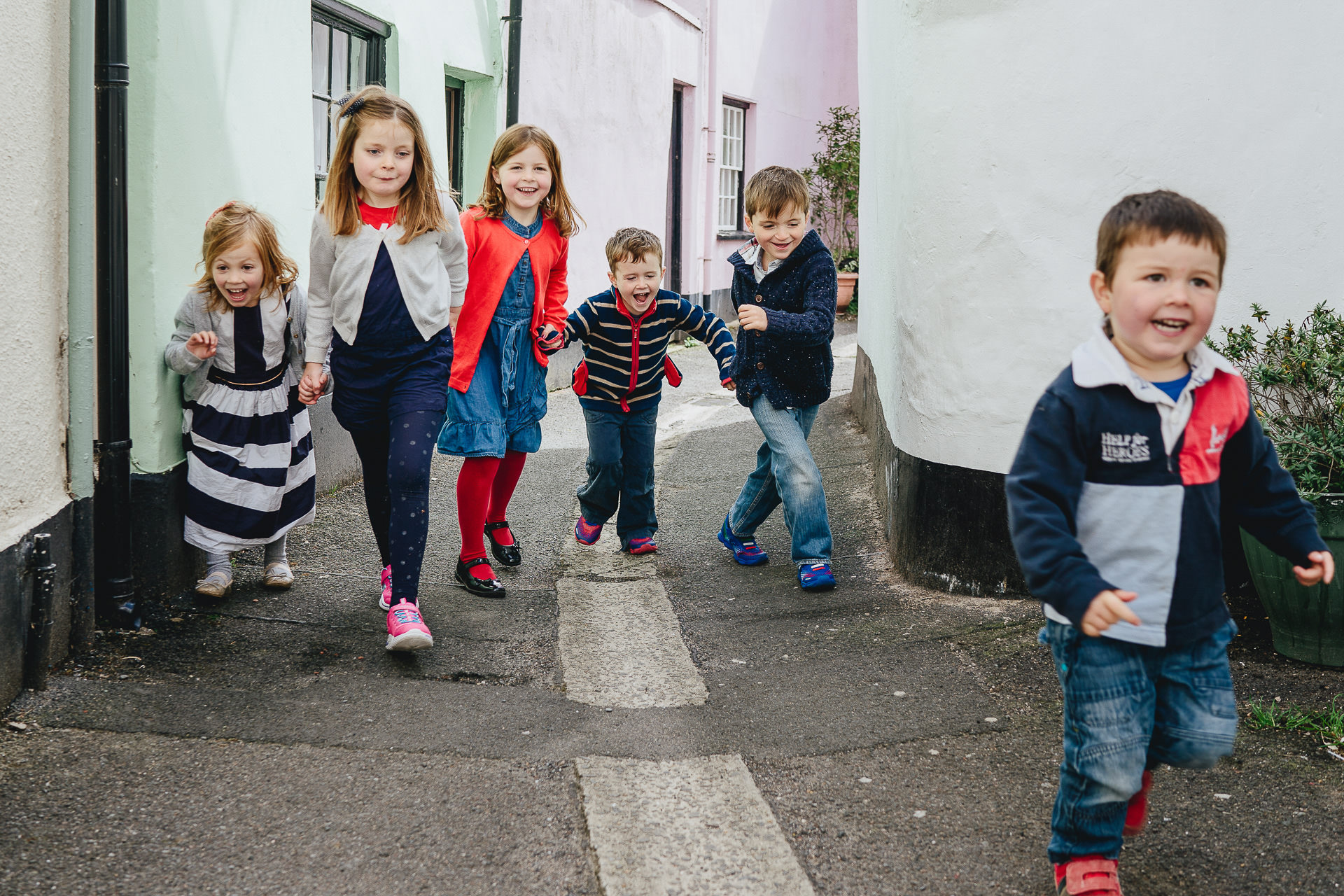 A group of children running through the streets at Appledore
