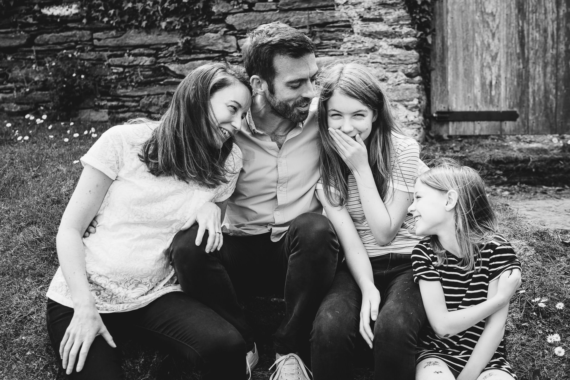 Parents with two daughters laughing together