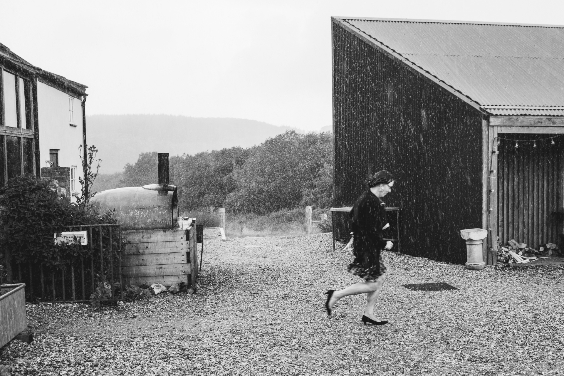 Rain on your wedding day with the celebrant running for cover through rain