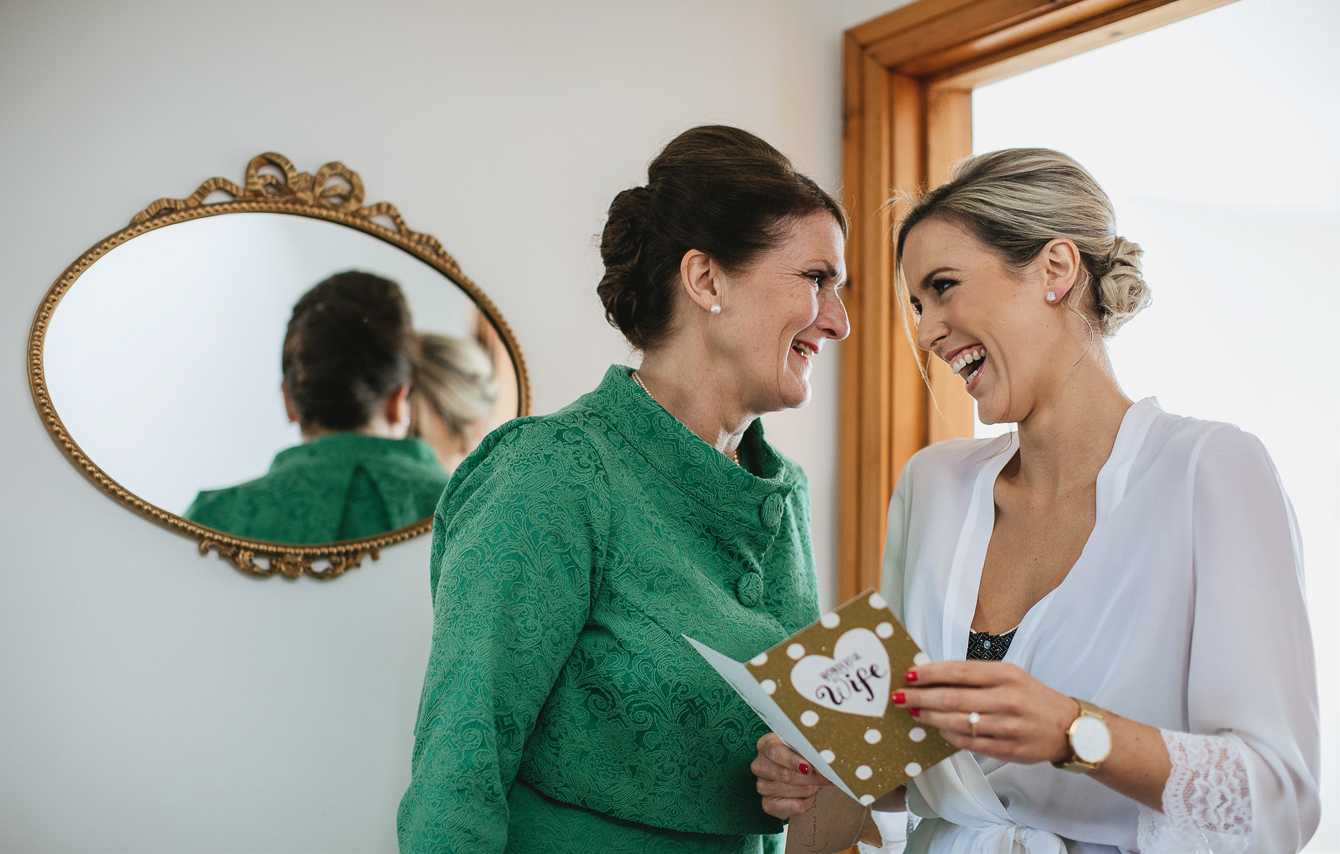 Bride to be and mother laughing together
