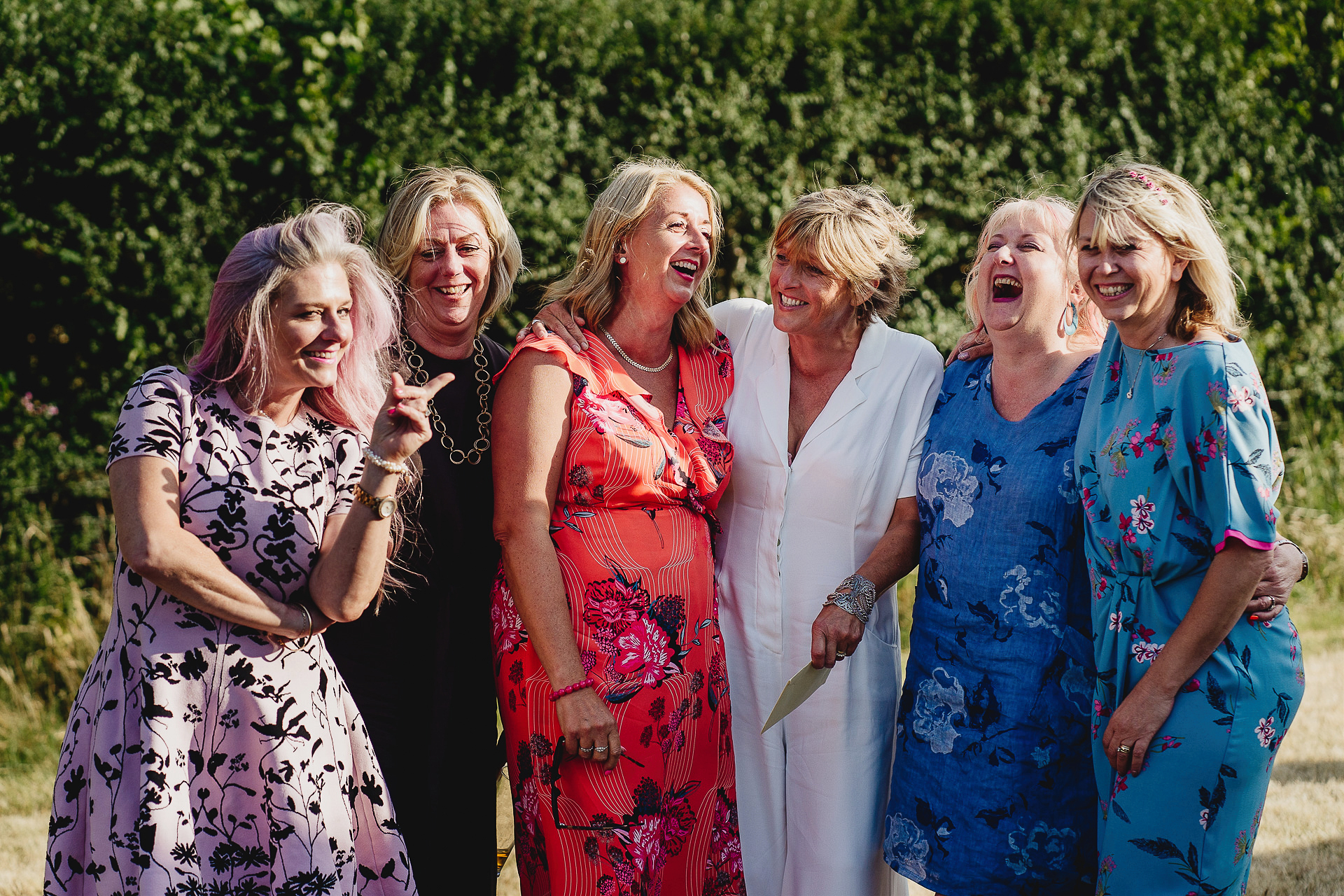 Group of women laughing together in a field