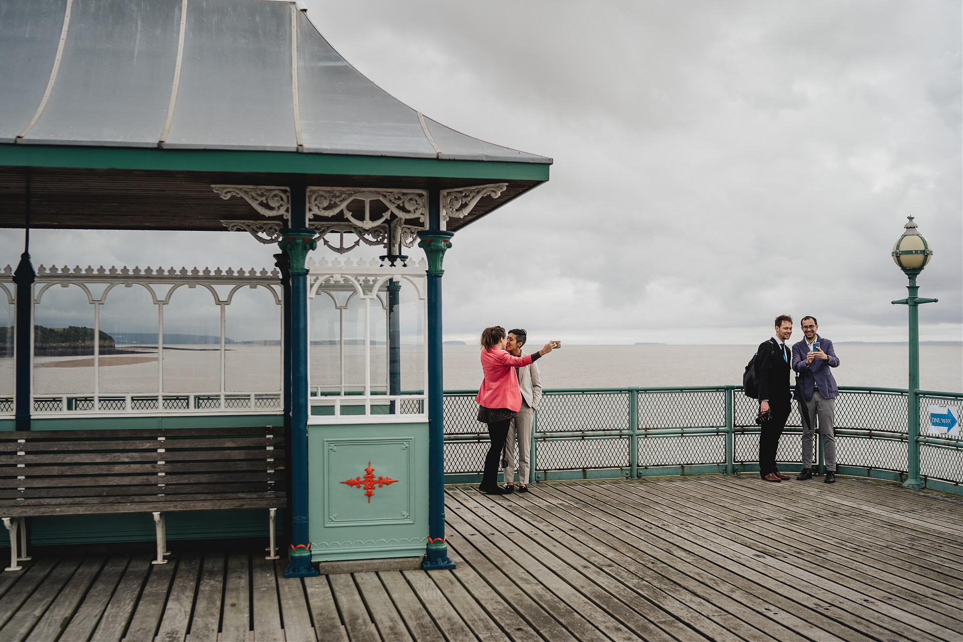 Couples taking selfies on Clevedon pier