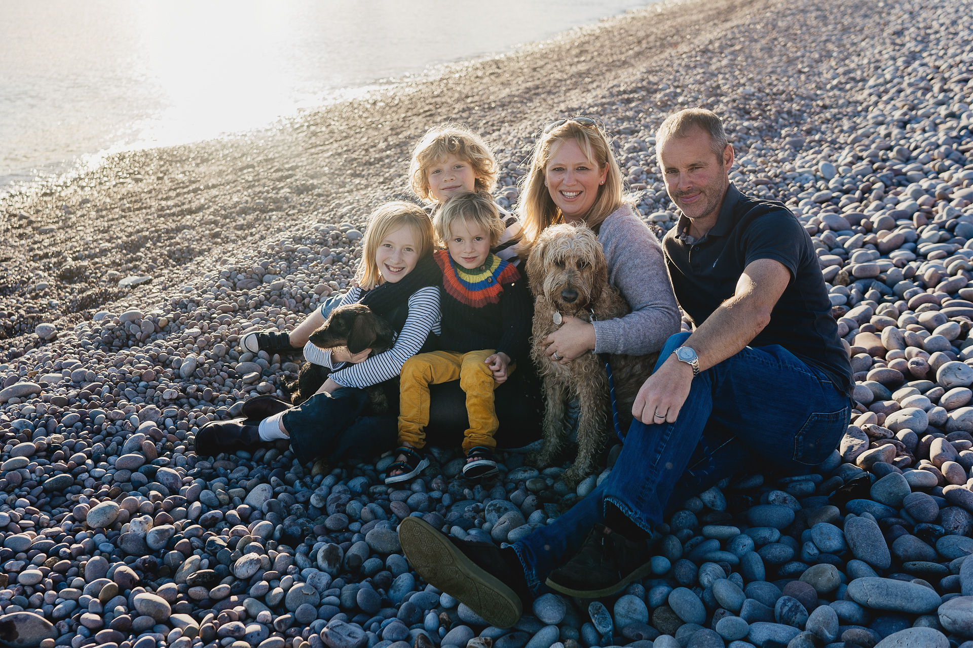 A family group photograph on a beach