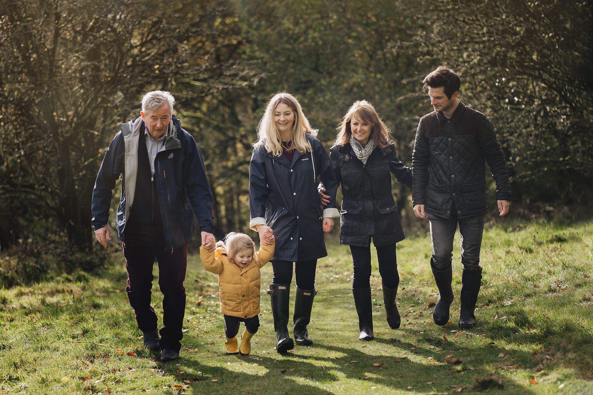 Dartmoor family photography of a family walking together in sunshine