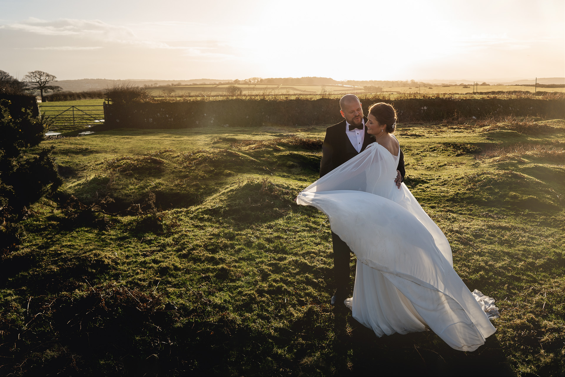 A bride and groom with cape on Dartmoor