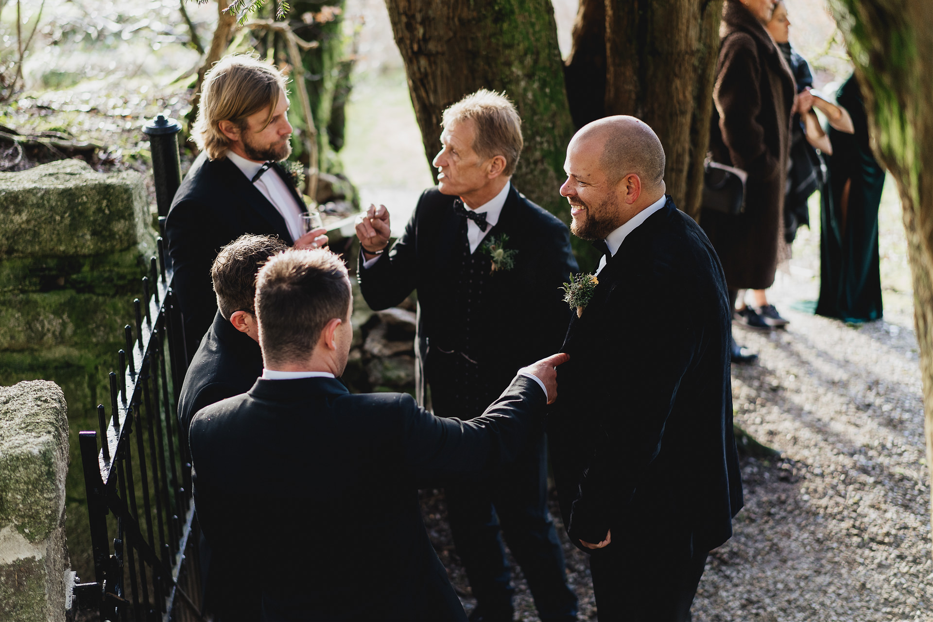 Groom and other wedding guests chatting
