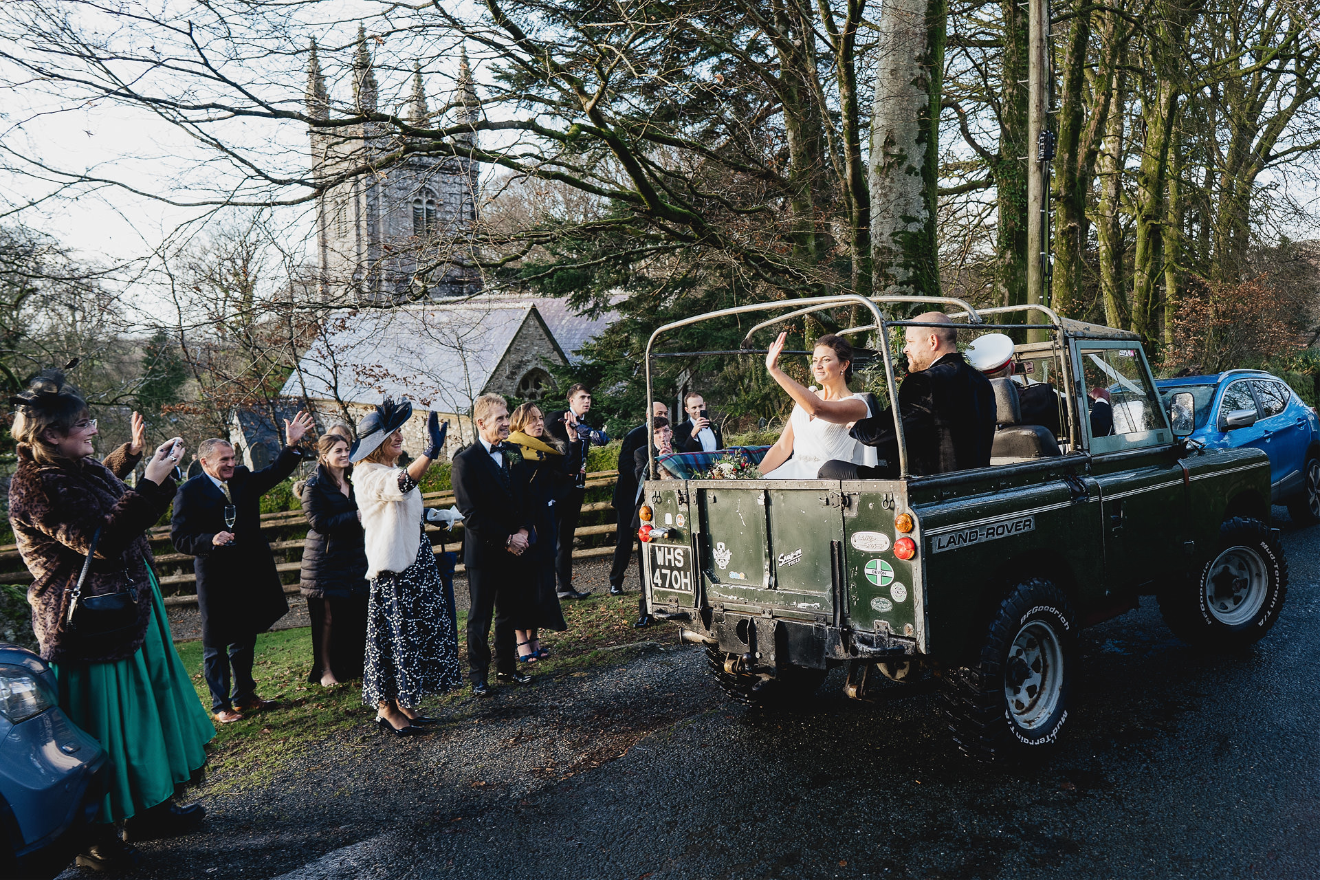 Bride and groom leaving church in a landcover