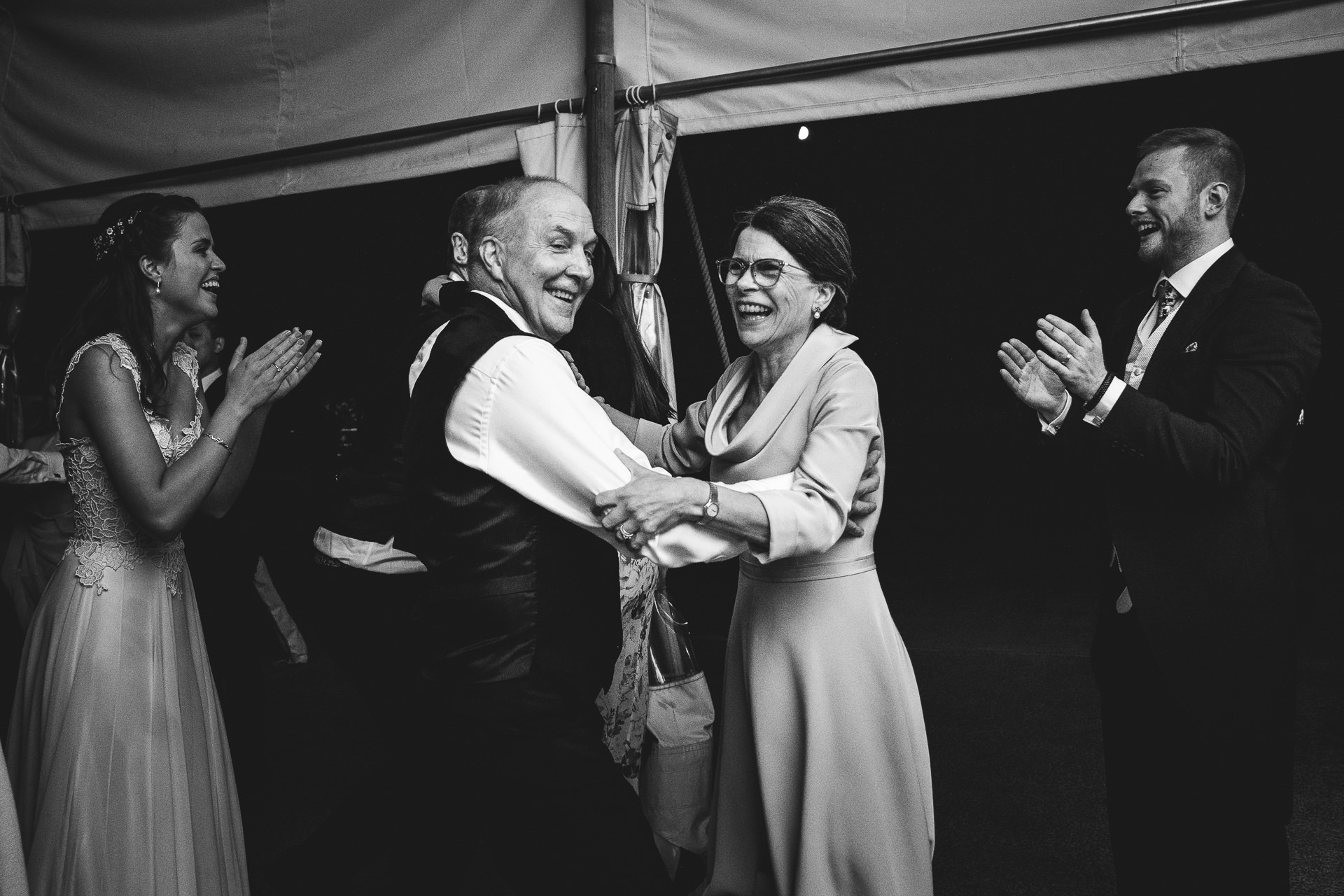 Wedding guests laughing and dancing
