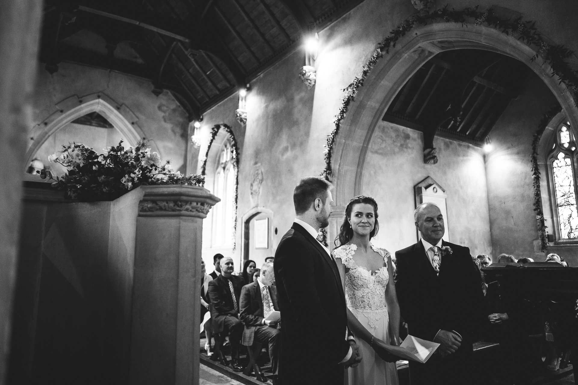 Bride and groom looking at each other in church