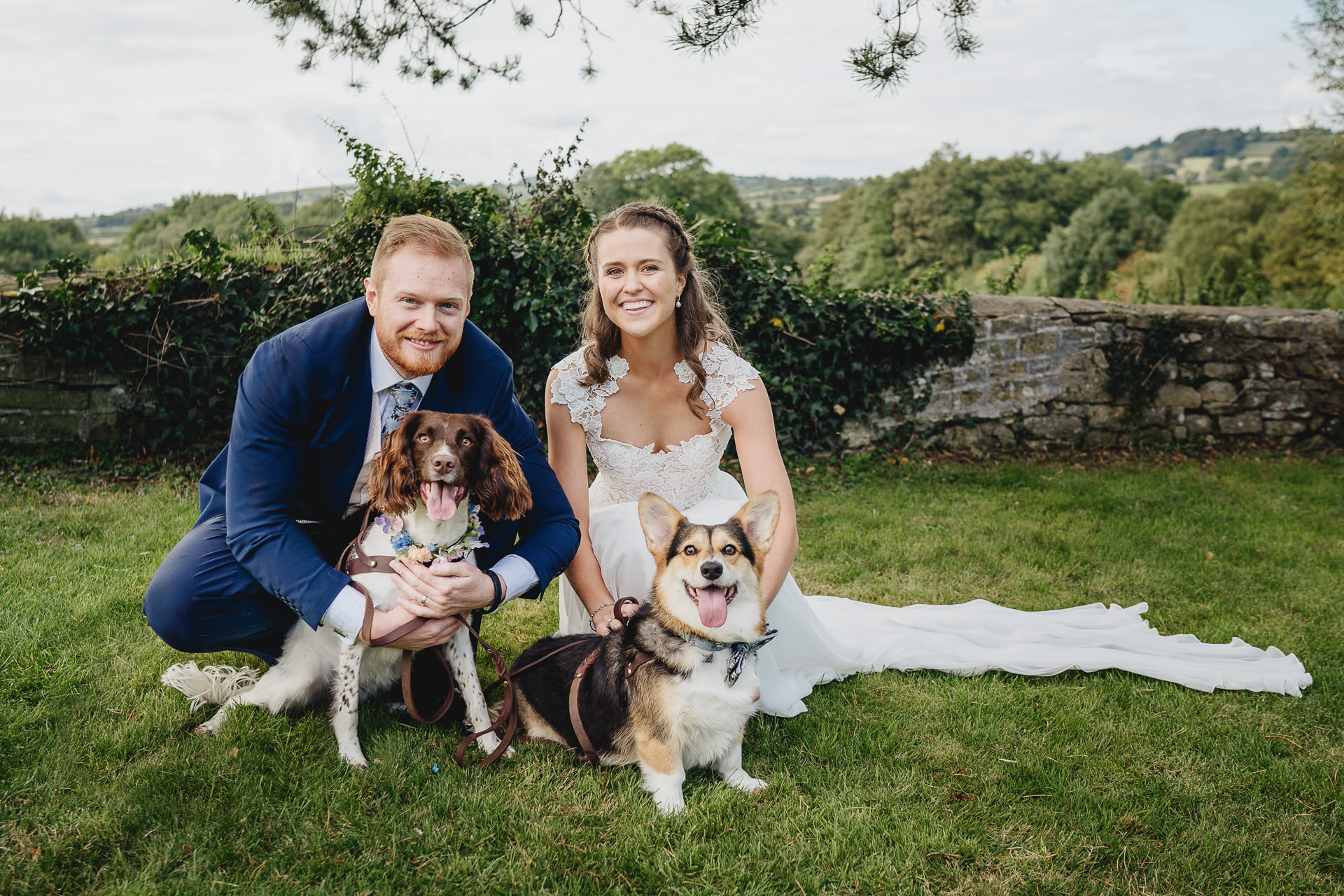 Bride and groom portrait with their two dogs