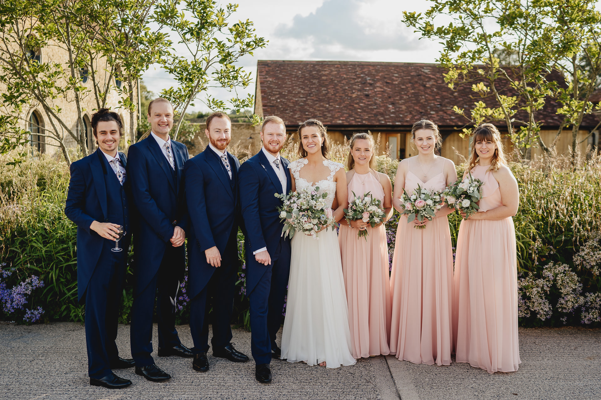 Group photo of bride and groom with wedding party at Hauser & Wirth Somerset