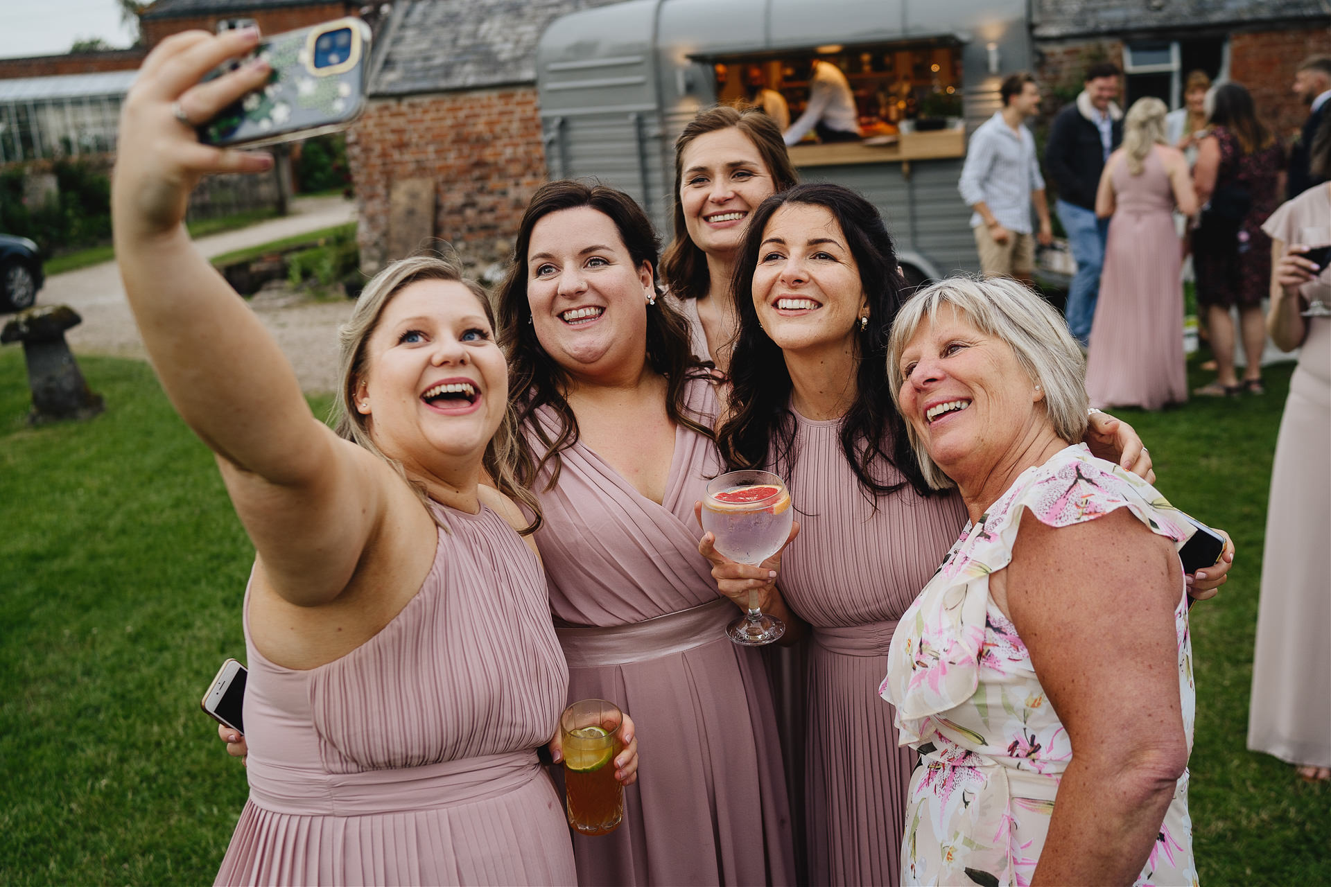 Bridesmaids taking a selfie at a wedding