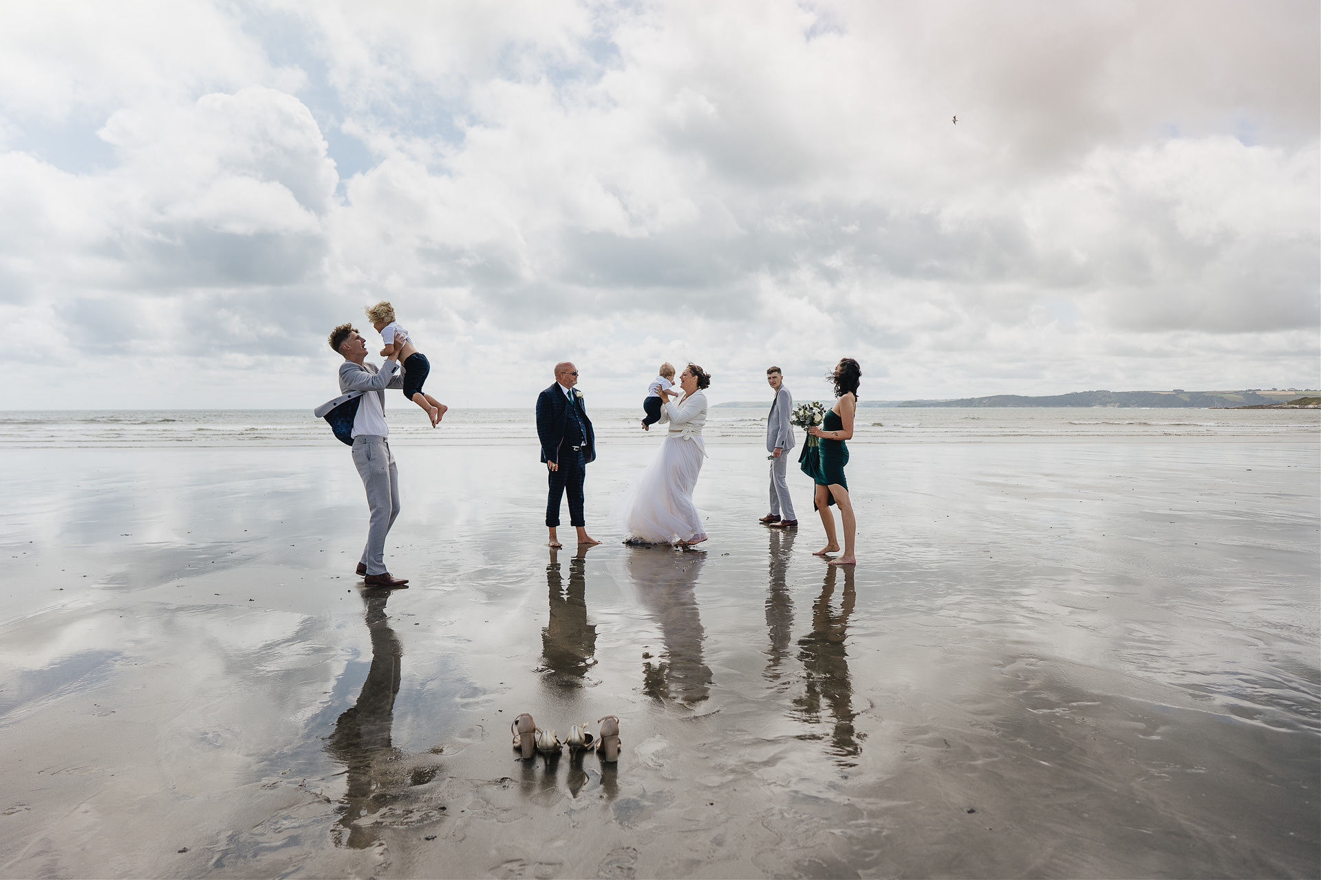 A family wedding celebration on the beach in Cornwall