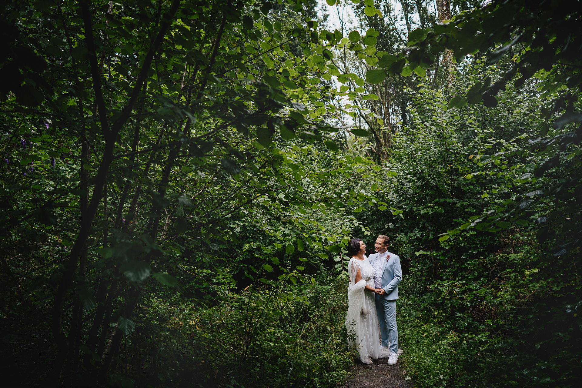 Bride and groom in a woodland wedding setting