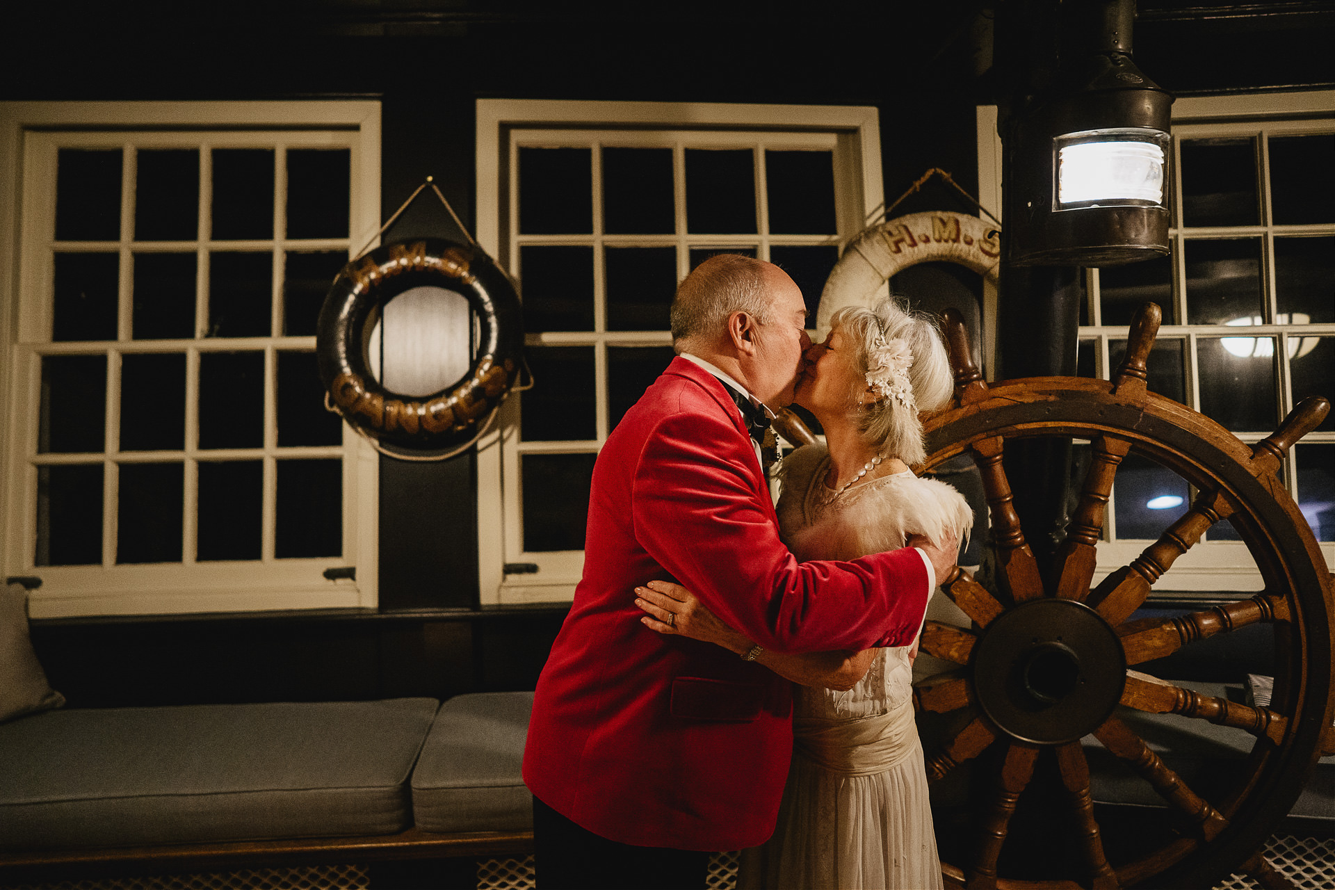 Bride and groom's first kiss in the Captain's Cabin at Burgh Island Hotel
