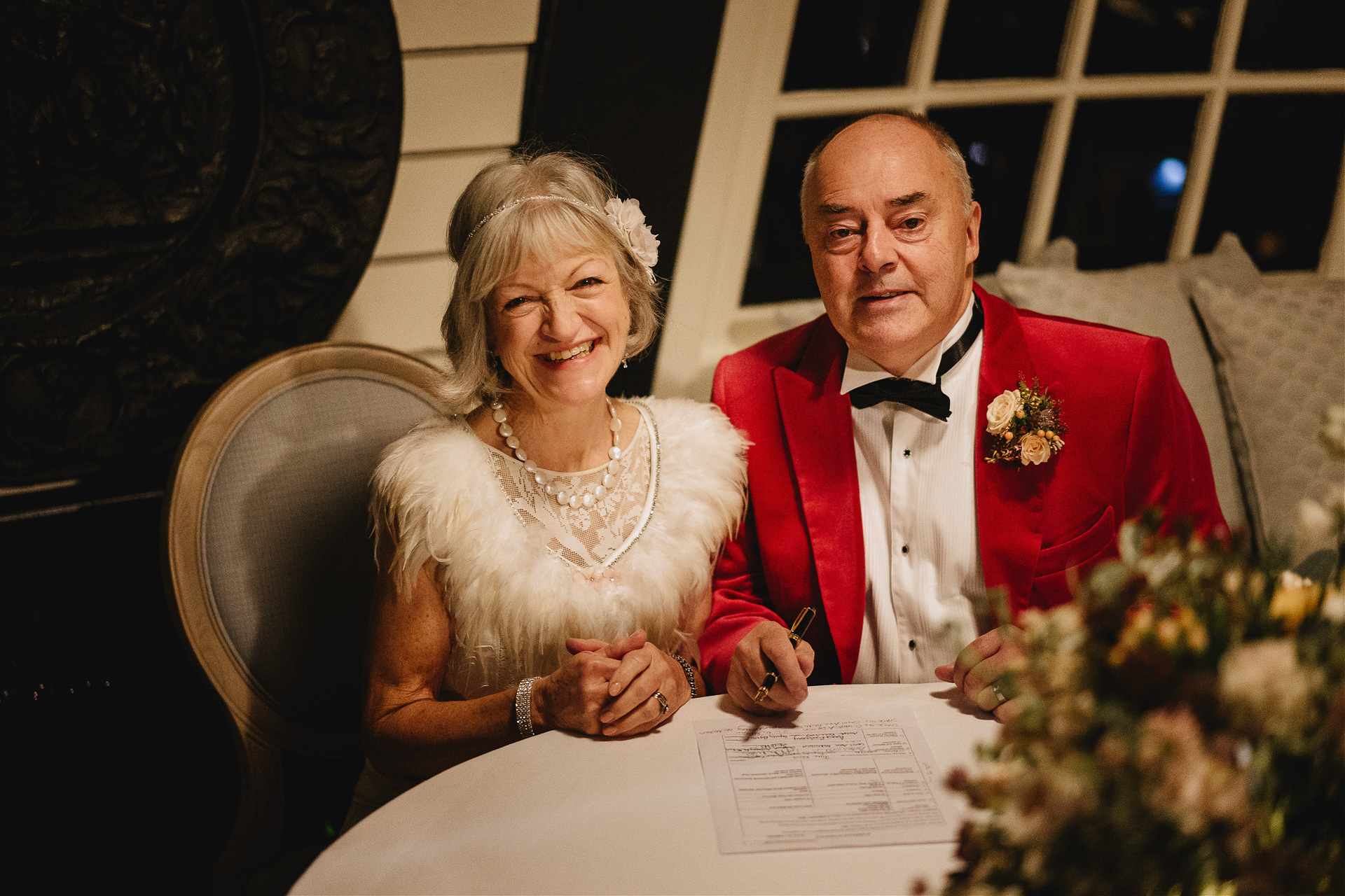 A couple signing the register at their marriage at Burgh Island Hotel