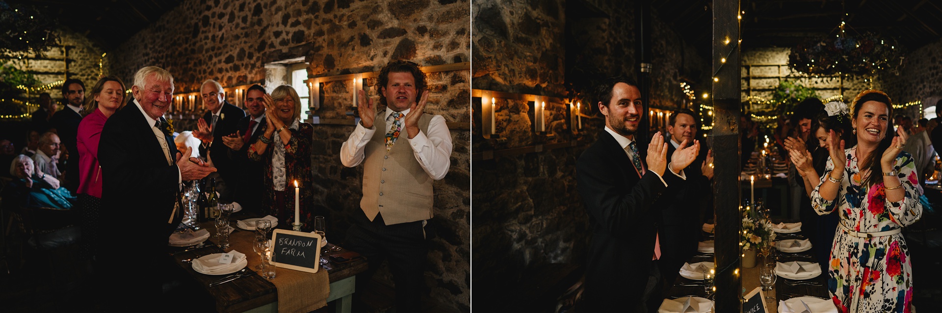 Wedding guests applauding in an amazingly atmospheric barn setting