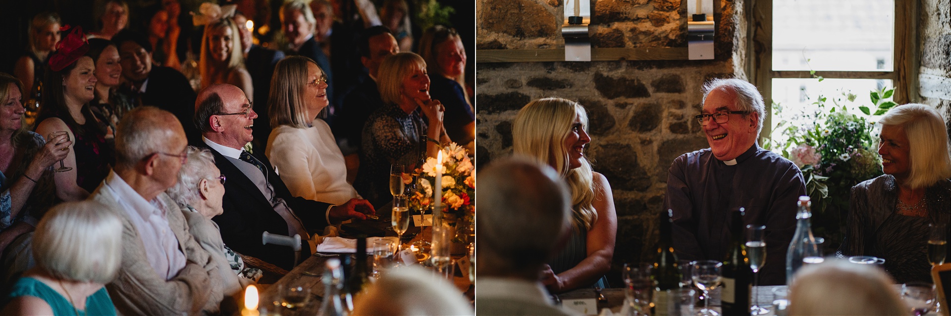 Wedding guests laughing in a stunning barn wedding venue