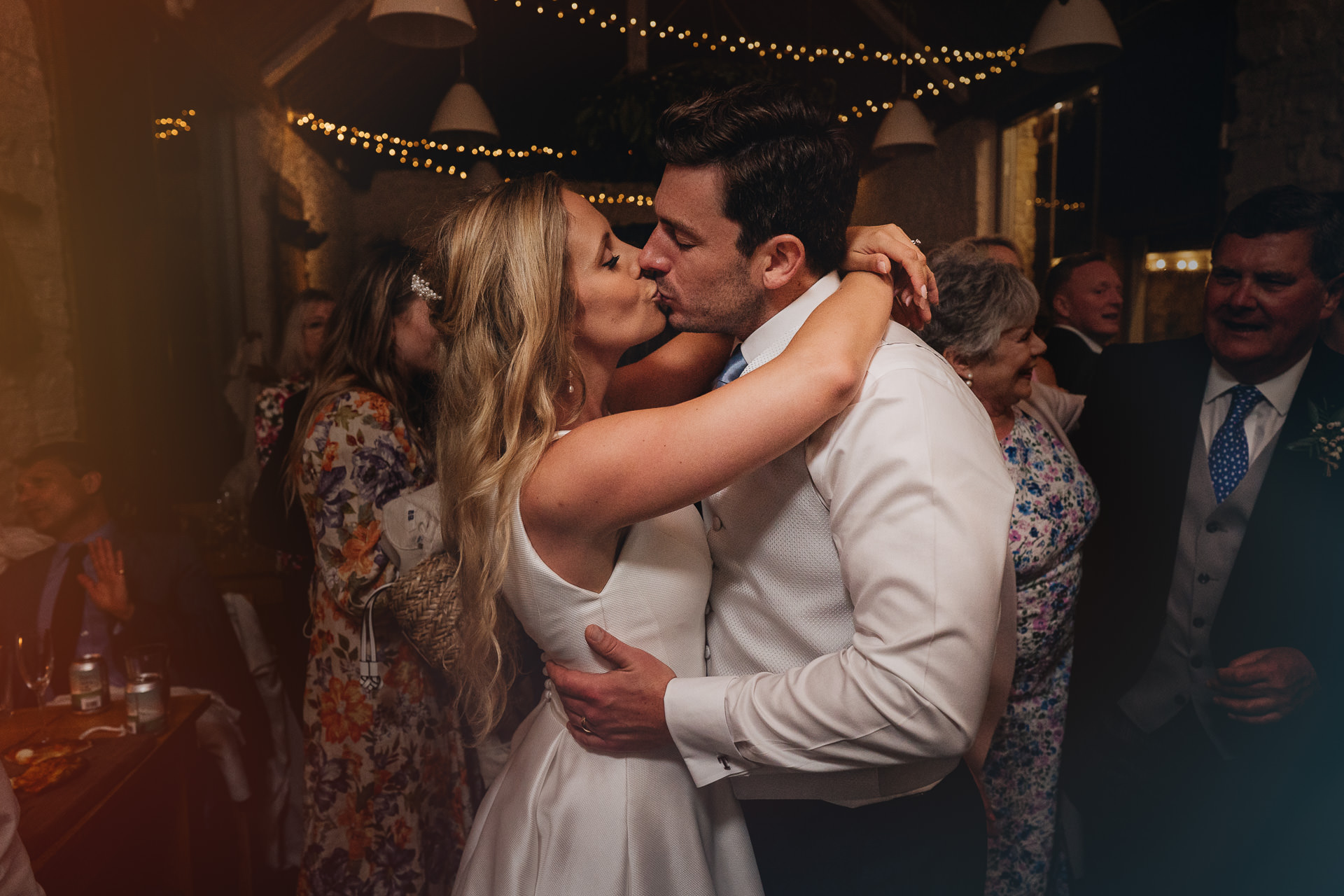Bride and groom kissing on the dancefloor at their wedding at River Cottage