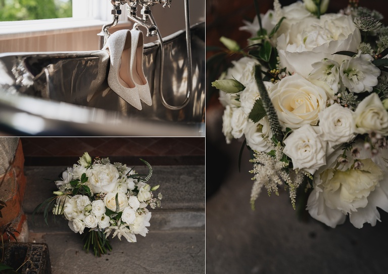 Beautiful white and green wedding bouquet, and bridal shoes hanging over a tin bath