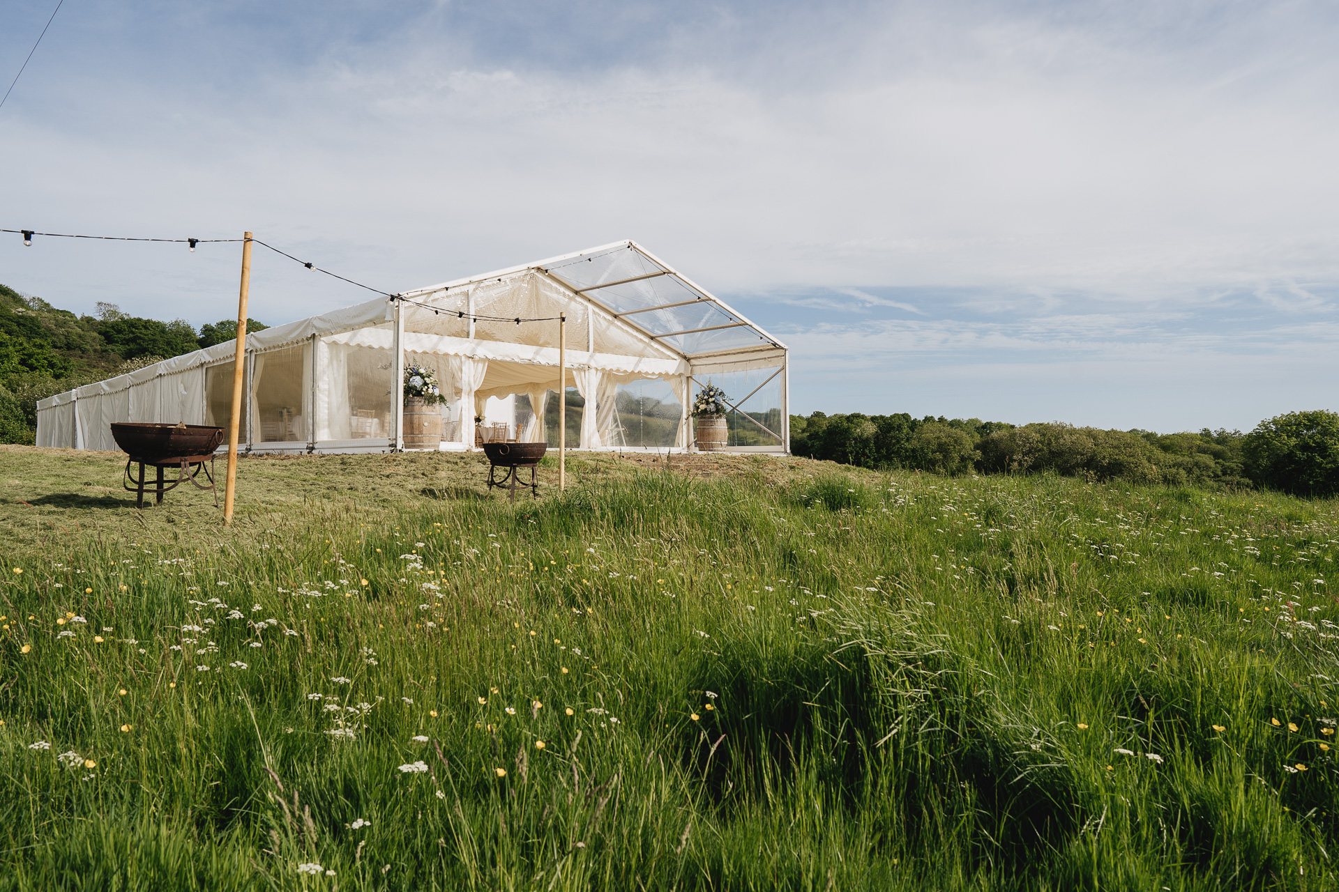 Marquee set up in a field for a wedding at River Cottage