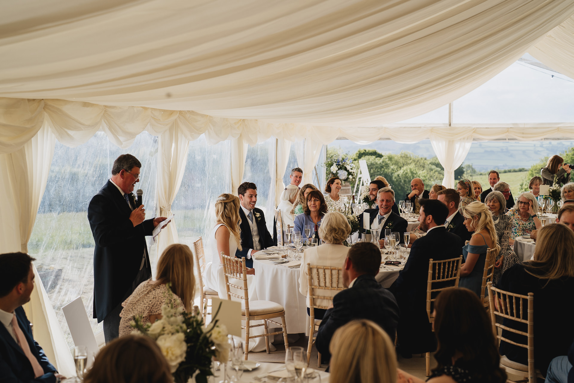 Wedding speeches in a marquee at River Cottage