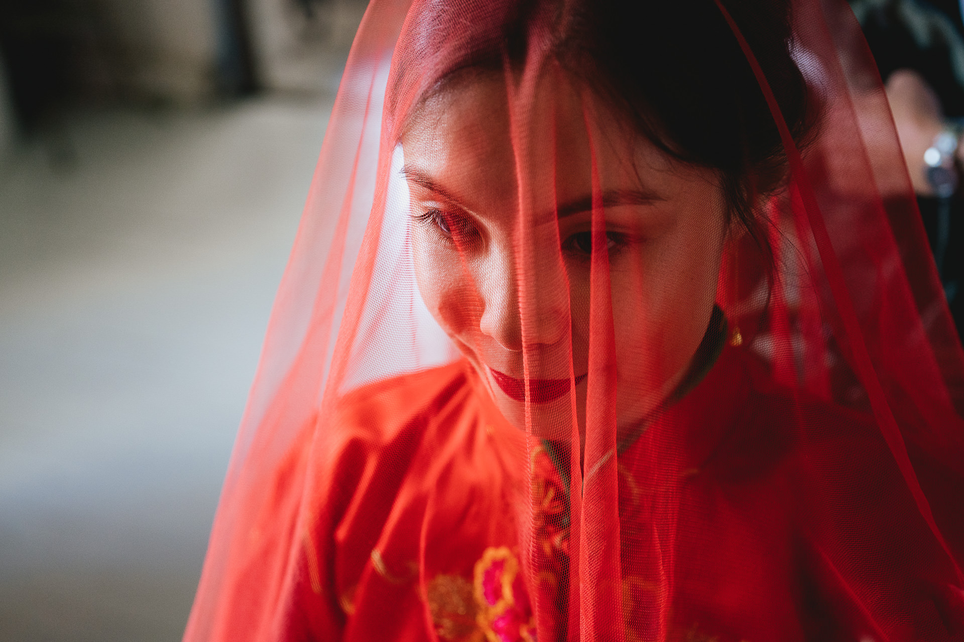 A bride dressed in red, ready for a Chinese tea ceremony