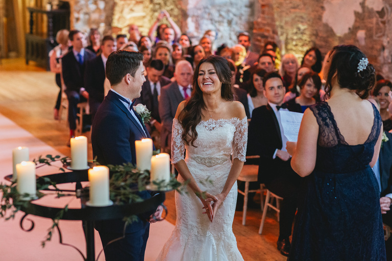 A winter wedding ceremony at Lulworth Castle in Dorset
