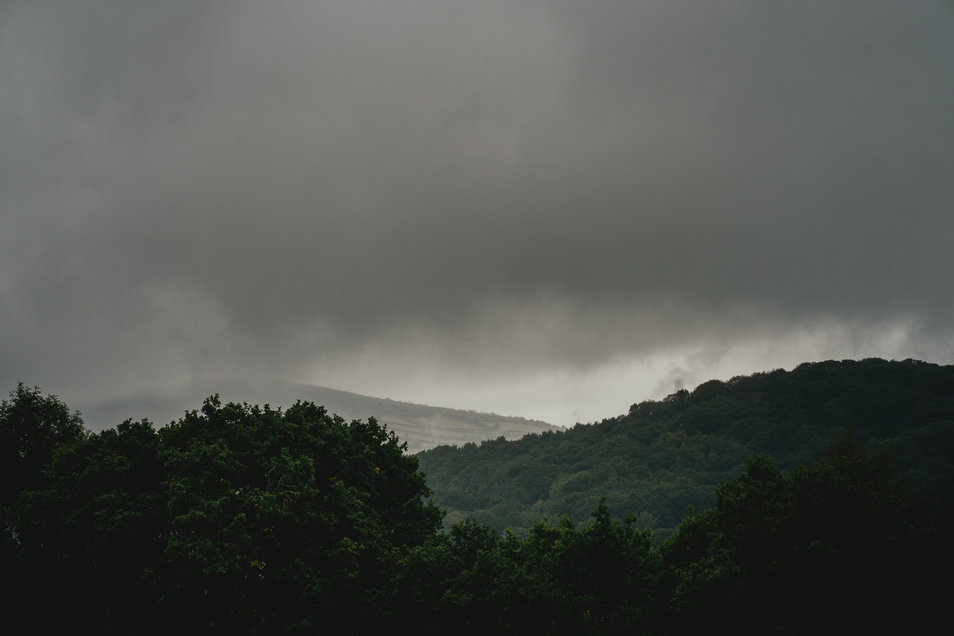 Grey storm clouds gathering over the distant views across Dartmoor