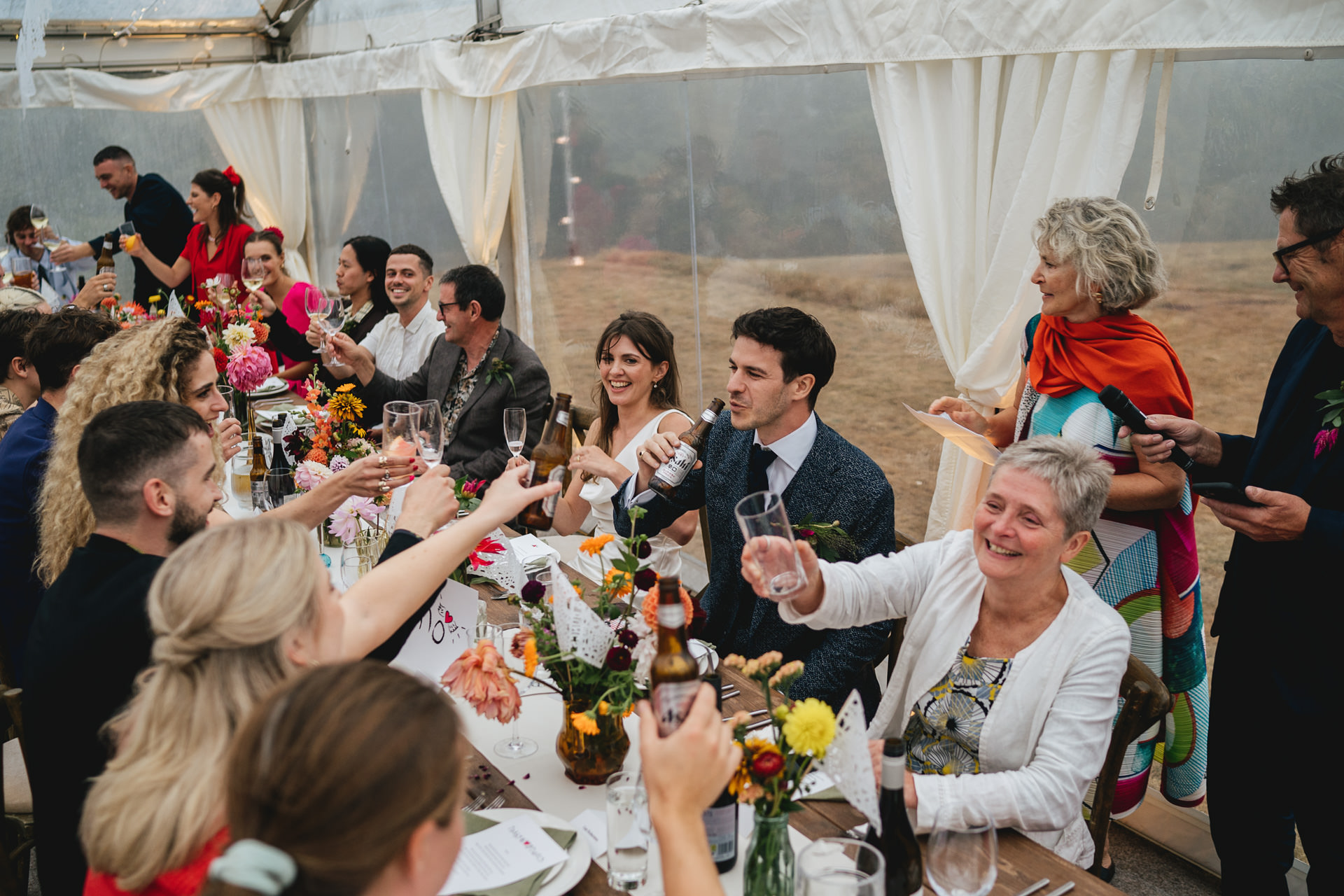 Wedding guests during speeches in a marquee on Dartmoor in Devon