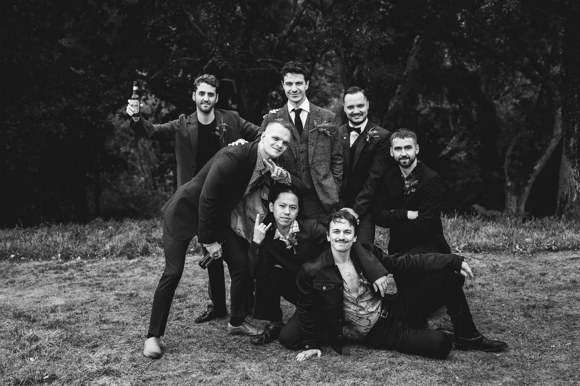 A relaxed group photo of groom and groomsmen at an outdoor wedding in Devon