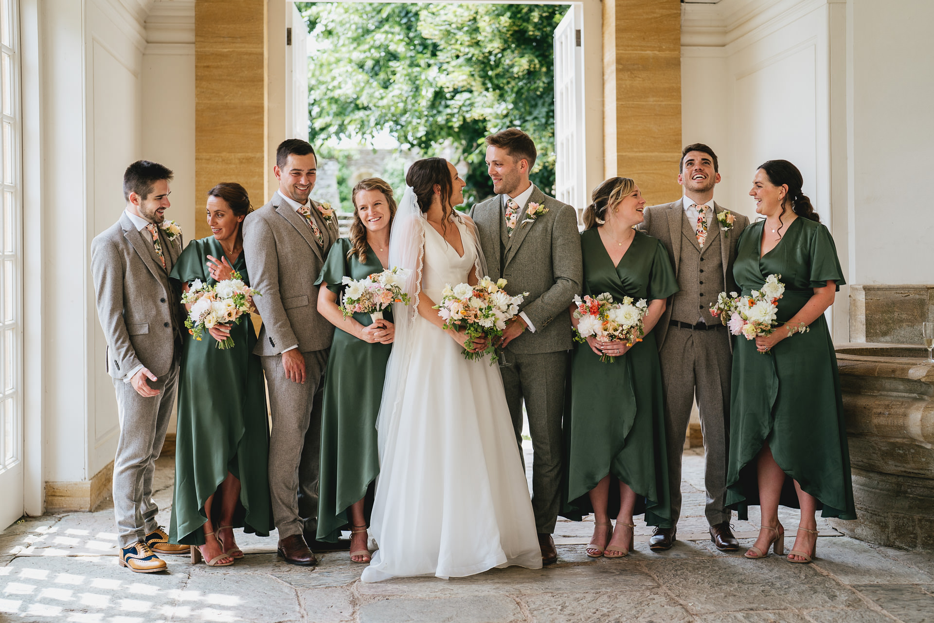A wedding group photo in the orangery at Hestercombe Gardens in Somerset