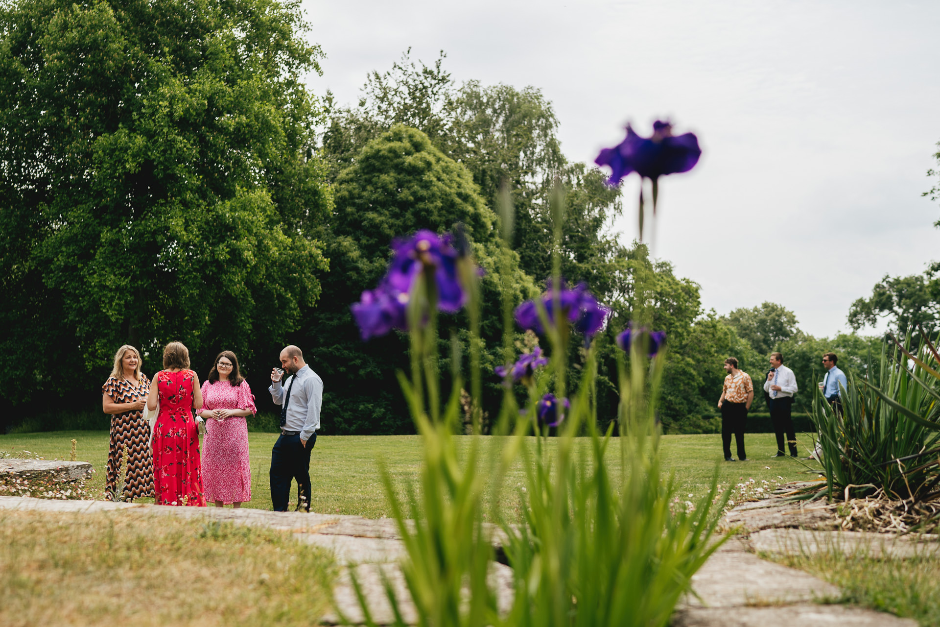 Wedding guests chatting in the gardens at Hestercombe