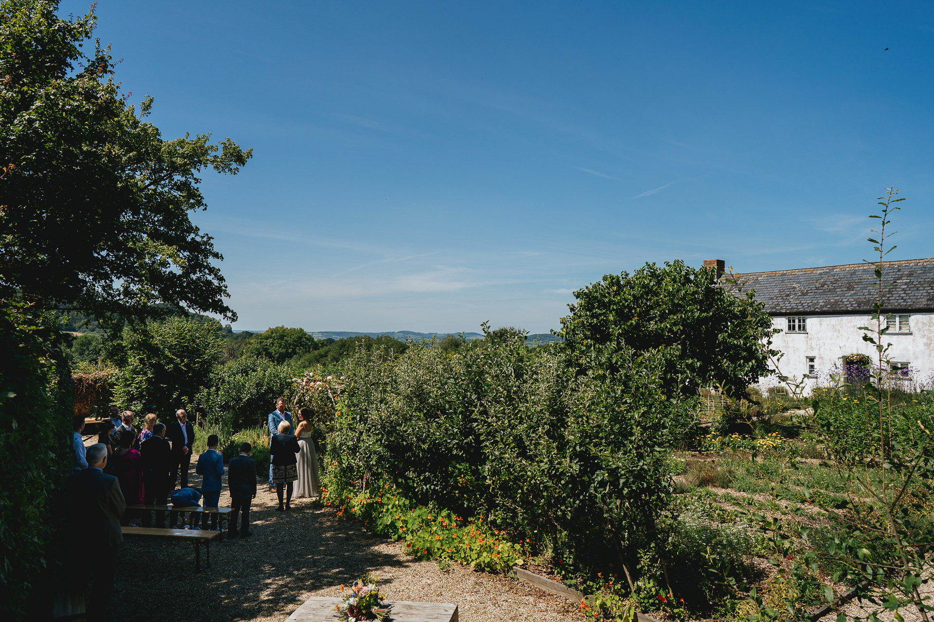 An elopement wedding ceremony in the kitchen garden at River Cottage