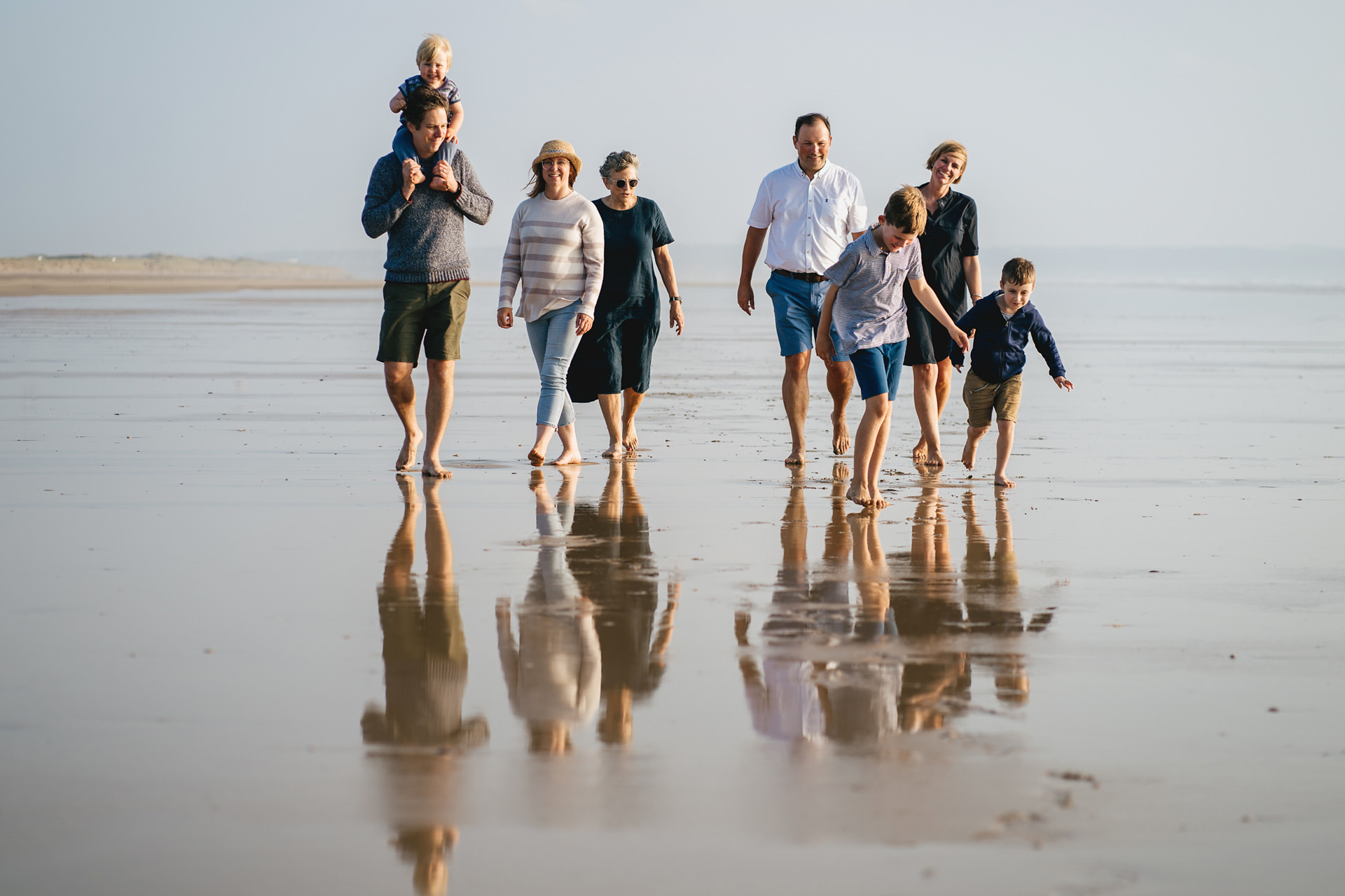 A family photography session on the beach on a summer evening