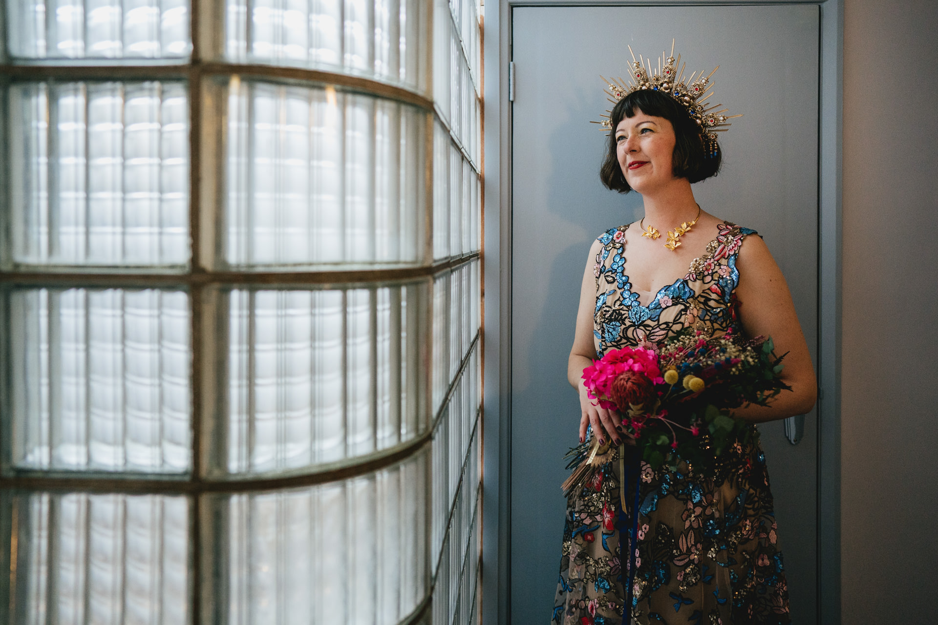 A bride in colourful beaded wedding dress with tiara headdress at Burgh Island Hotel