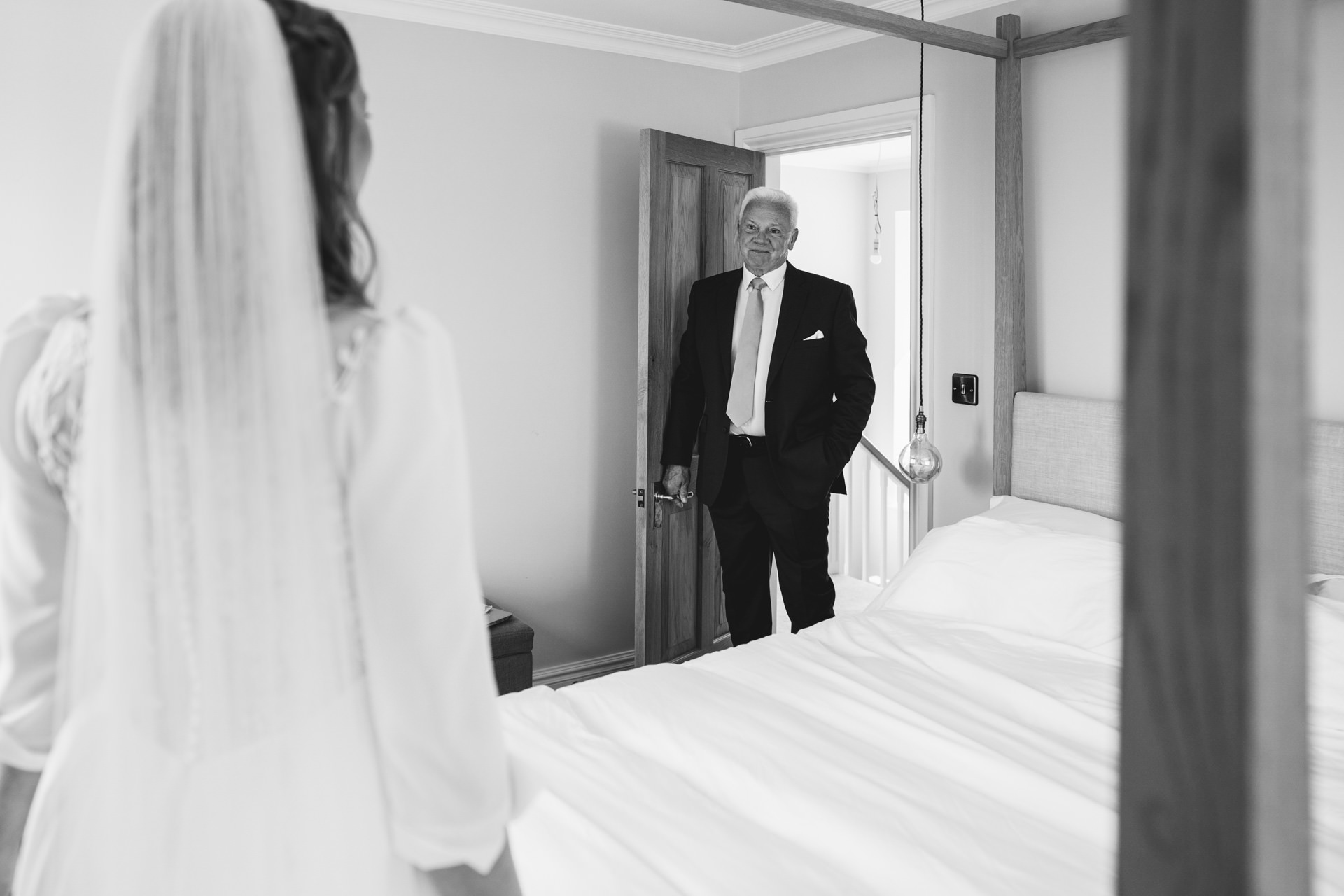 A father seeing his daughter in her wedding dress before her Devon wedding ceremony