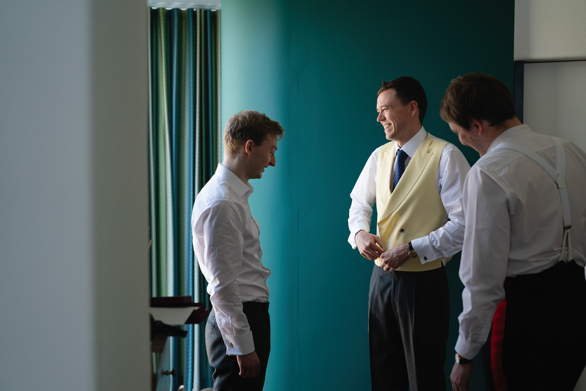 A groom and friends getting ready for a Devon wedding