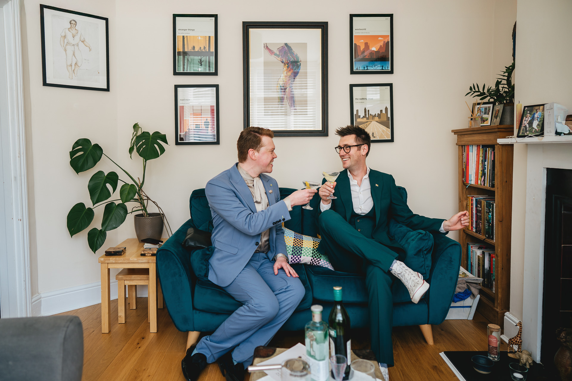 Two grooms with martinis in their home in Exeter, on the morning of their wedding day