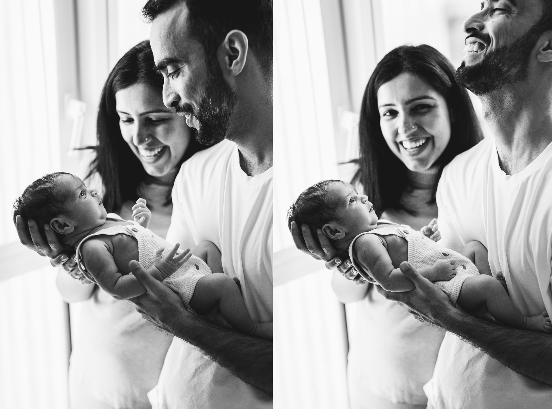 Parents holding a newborn baby for photos and laughing together