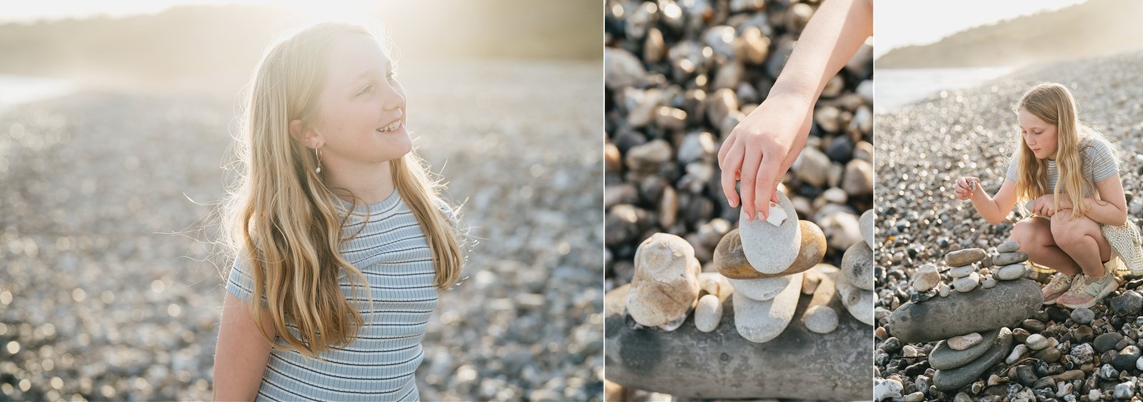 A young girl playing with beach pebbles during a family photography session on the beach in Lyme Regis