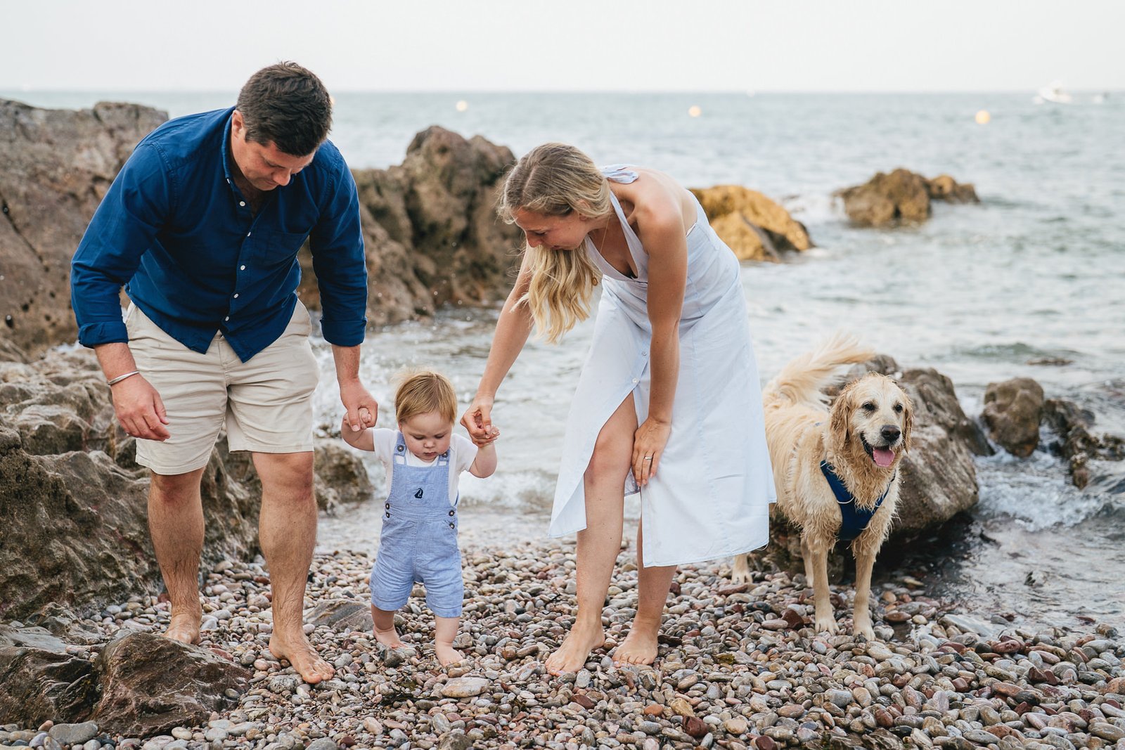 A relaxed family portrait on the beach at Elberry Cove in Torbay