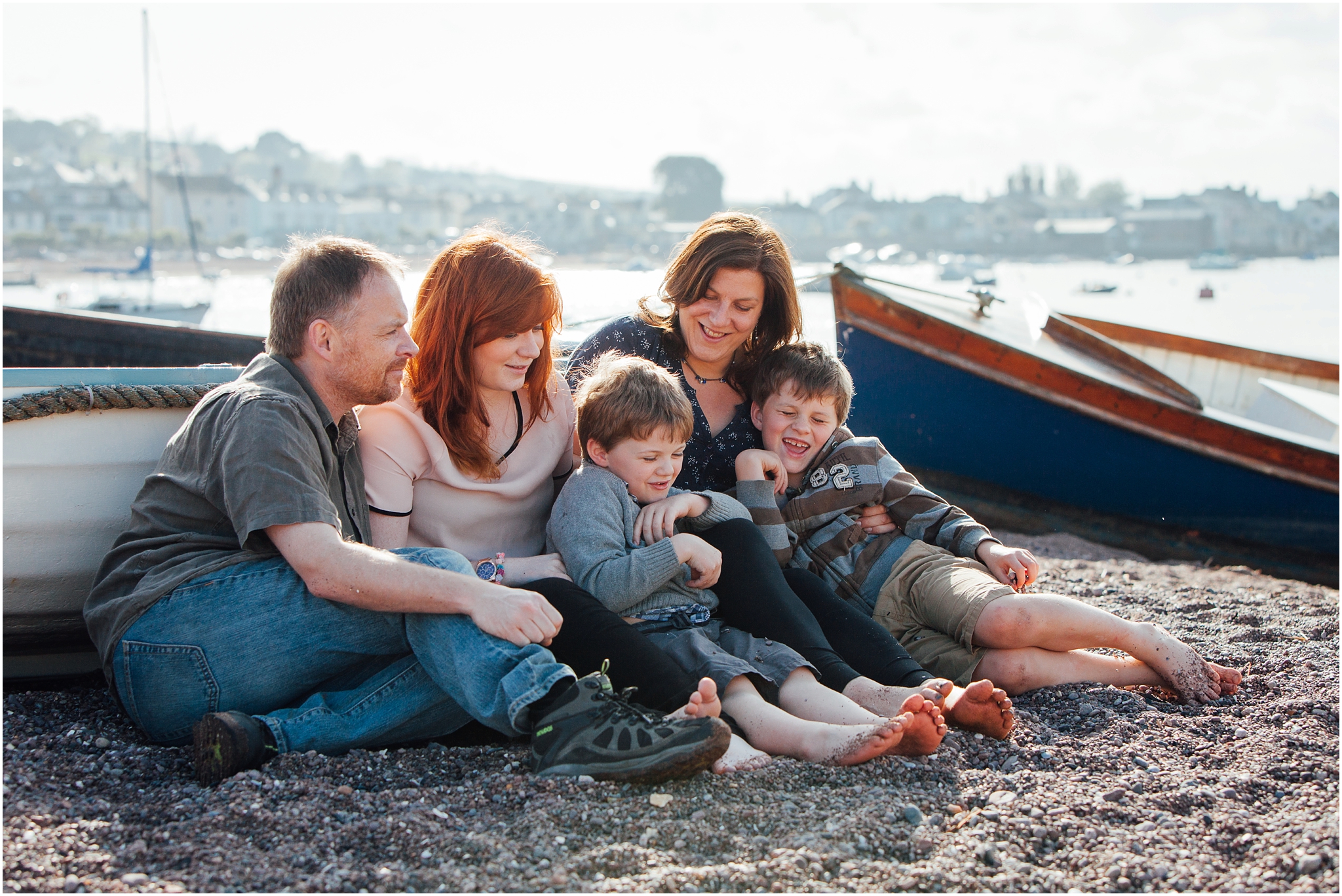 Photographer Helen Lisk with her family sitting on the beach in Teignmouth, Devon